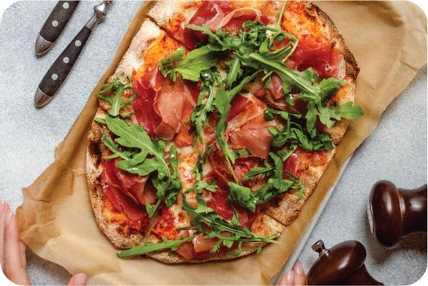 Wholegrain Pizza with Rocket Tomato & Prosciutto